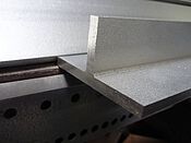 Frontview laserfused T section with raw and polished surface in the grade AISI 304 and AISI 316